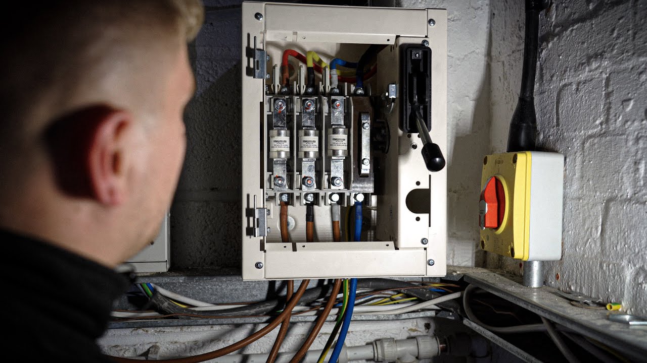 Electrician replacing a fuse in Birmingham property